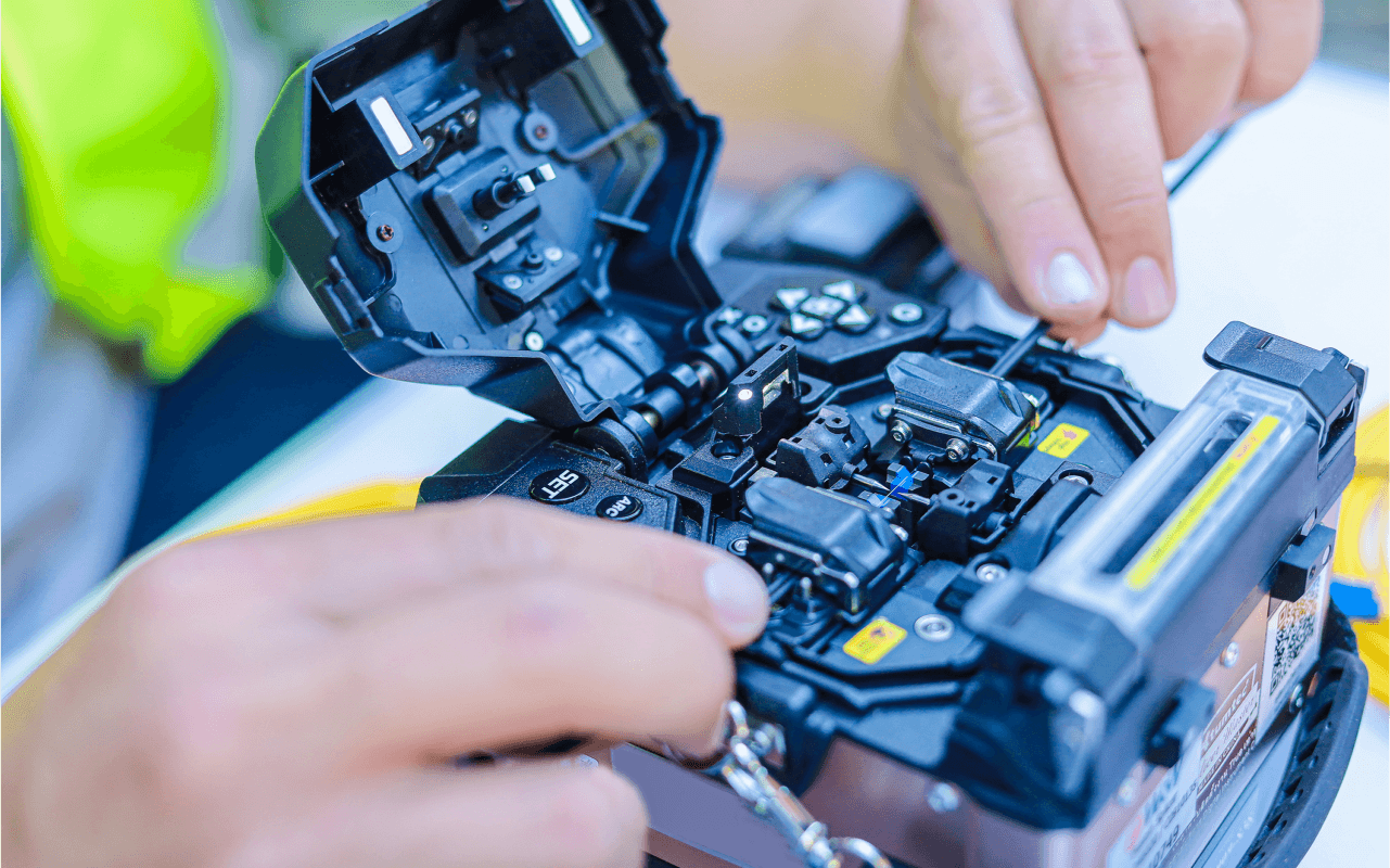 Fiber optic cable splicing process in progress.