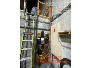 Ladder and wiring setup in industrial space.
